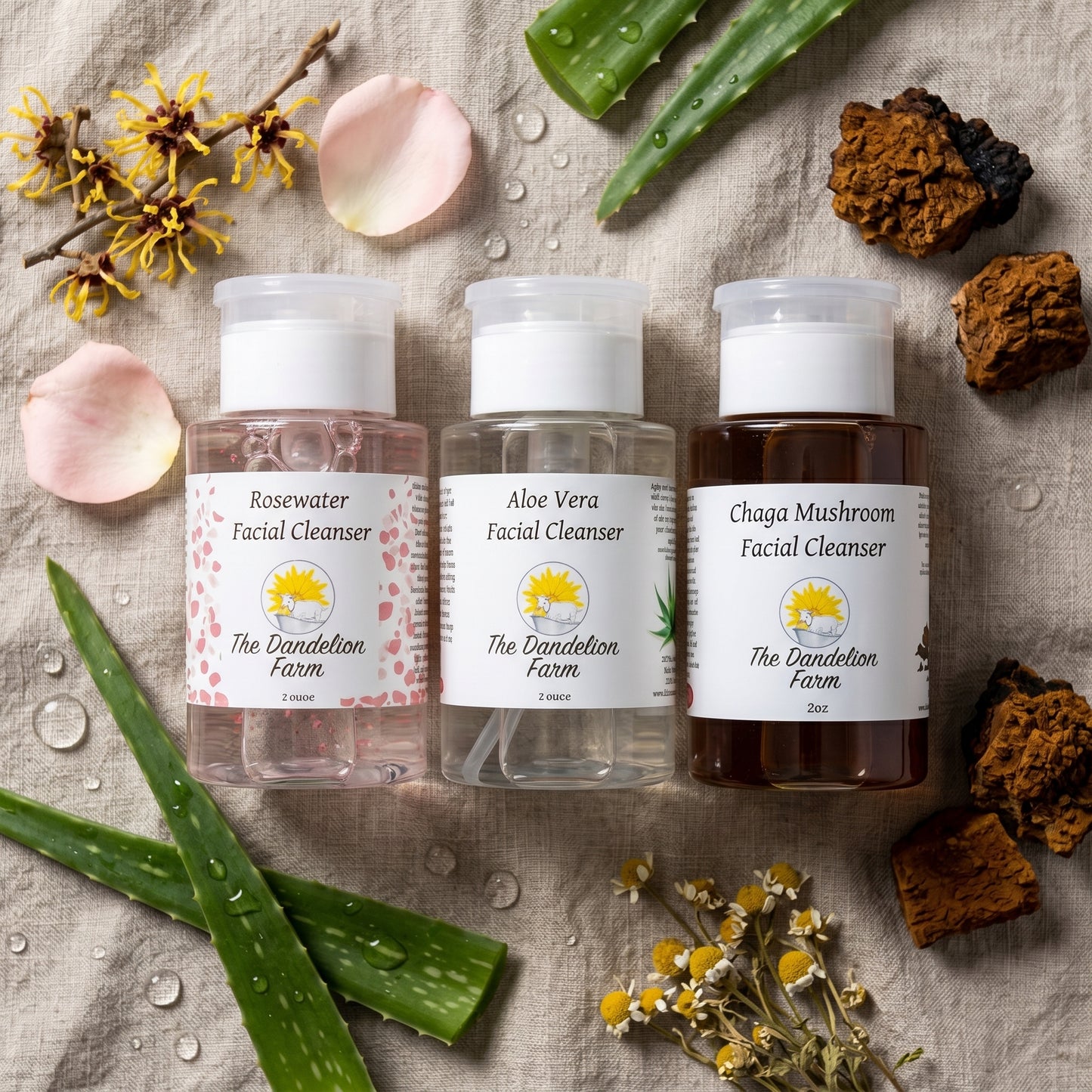 Overhead scene of facial cleanser surrounded by botanicals, water droplets, and linens on neutral cloth for calm ambiance.