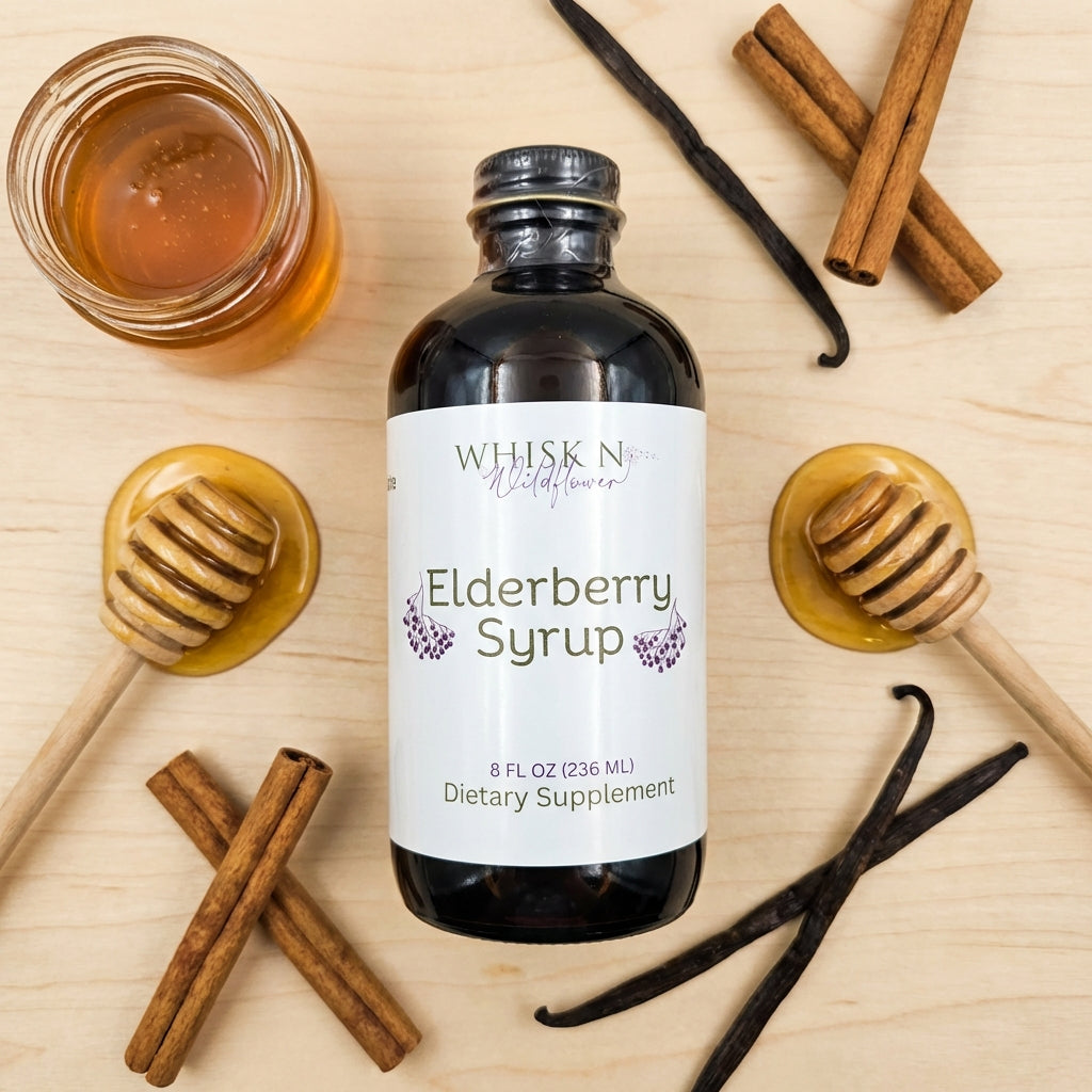 An elegant, studio-style flat lay featuring the 2 oz elderberry syrup bottle at the center, surrounded by ingredients like raw Wisconsin honey, Ceylon cinnamon sticks, and vanilla beans, all positioned on a light wooden surface. The scene is lit with HDR s