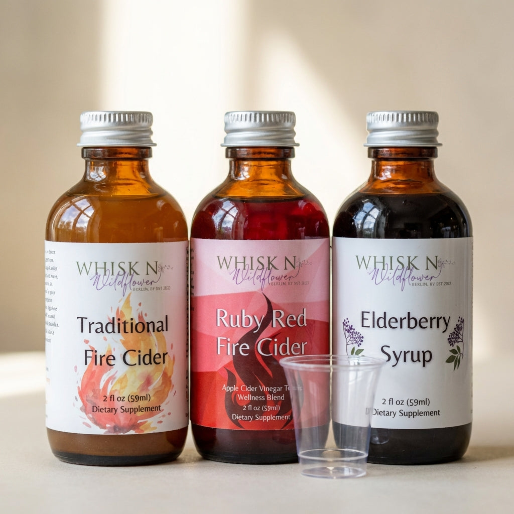 A close-up, detailed macro shot of the 'Wellness Trio' bottles, emphasizing the textured glass surfaces and vibrant label designs. Use diffused daylight studio lighting from the side to accentuate the transparent liquids inside, capturing their rich color