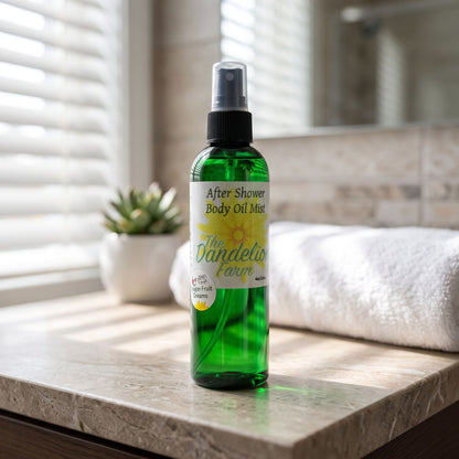 Close-up of lightweight after shower body oil mist on stone countertop with soft daylight.