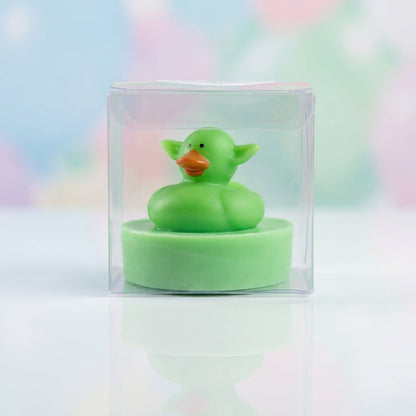A close-up shot of a single Little Buds Soap bar standing upright on a glossy white surface, with a subtle reflection underneath. The lighting setup uses HDR studio lights to create a bright, hyper-realistic effect that accentuates the soap's smooth, round