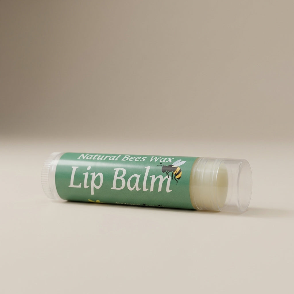 A close-up shot of the 'Natural Bees Wax Lip Balm' set against a soft, neutral beige background under diffused daylight studio lighting. The camera, positioned at a slight angle with a 50mm lens, captures the sleek, matte texture of the lip balm tubes with