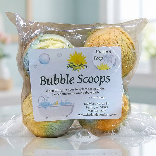 A close-up of a vibrant Bubble Scoop set against a soft pastel background, shot with a macro lens using a 100mm focal length, capturing the intricate texture of the handcrafted natural ingredients. Softbox lighting highlights the glossy, colorful surface o