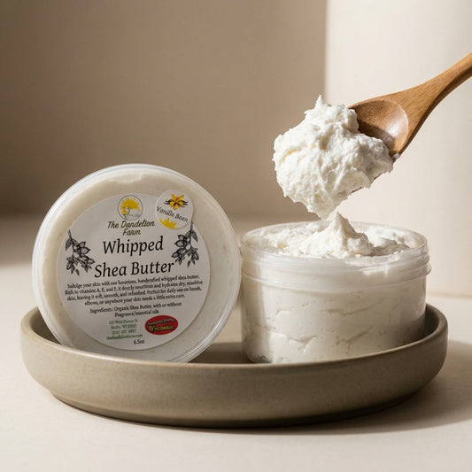 A minimalist product studio shot featuring a close-up of a spoonful of whipped shea butter being lifted from a matte ceramic bowl, shot with a 100mm macro lens to emphasize the fluffy, cloud-like texture. Rim lighting from the side accentuates the gentle p