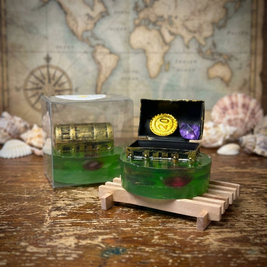 A highly detailed studio shot of the 'Treasure Chest Soaps' arranged on a vintage wooden table, captured with a macro lens at 100mm focal length, showcasing the intricate craftsmanship of the handcrafted soap shaped like a treasure chest. Softbox lighting 