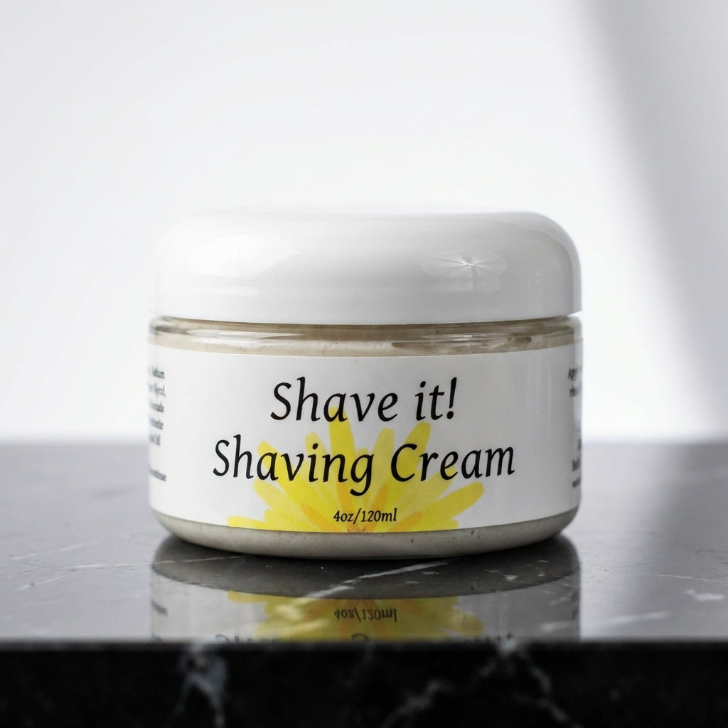 A high-resolution, close-up shot of the 'Shave it! Shaving Cream' container prominently positioned on a sleek, reflective black marble countertop, accented by softbox studio lighting that emphasizes the smooth, creamy texture of the cream and the bold, mod