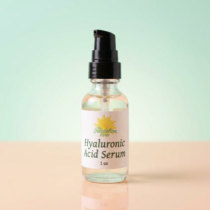 A highly detailed product shot showcasing the Hyaluronic Acid Serum against a minimalistic, pastel-colored studio backdrop. Diffused daylight studio lighting highlights the serum’s transparent, slightly viscous appearance and the sophisticated dropper cap.