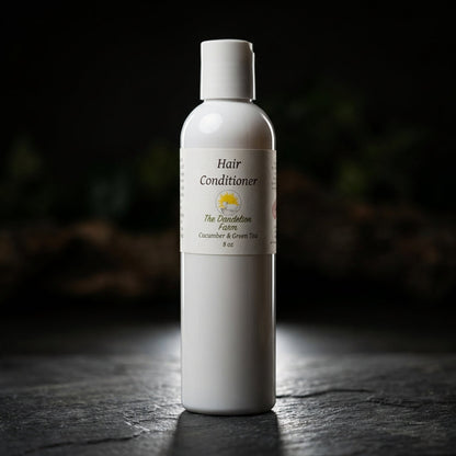 Present a dynamic, high-contrast studio scene featuring the Hair Conditioner bottle on a textured stone surface, illuminated by rim lighting to create a striking outline that makes the product pop against a dark, moody background. Employ a high-resolution 