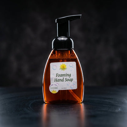 A high-contrast, studio studio image of the foaming hand soap pump against a dark, textured backdrop for dramatic effect. The pump is illuminated by HDR studio lights with rim lighting to accentuate the contours and bubbles within the foam visible through 