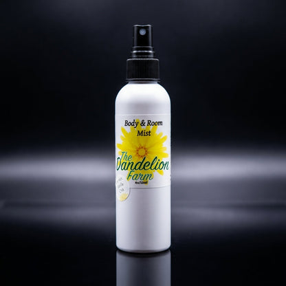 Present a dramatic product display of the 'Body & Room Mist' in a clean, modern retail environment. Use HDR studio lighting with high contrast to accentuate the sleek profile and textured surface of the dark-colored matte bottle standing tall on a reflecti