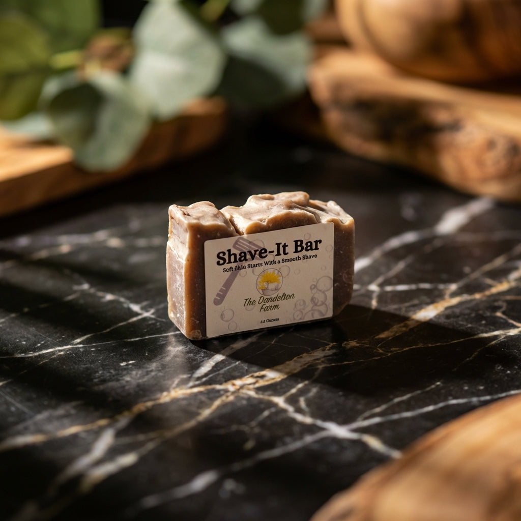 Miniature Shave-It Bar on dark marble with dramatic lighting, highlighting creamy texture and natural ingredients like avocado and cocoa butter.