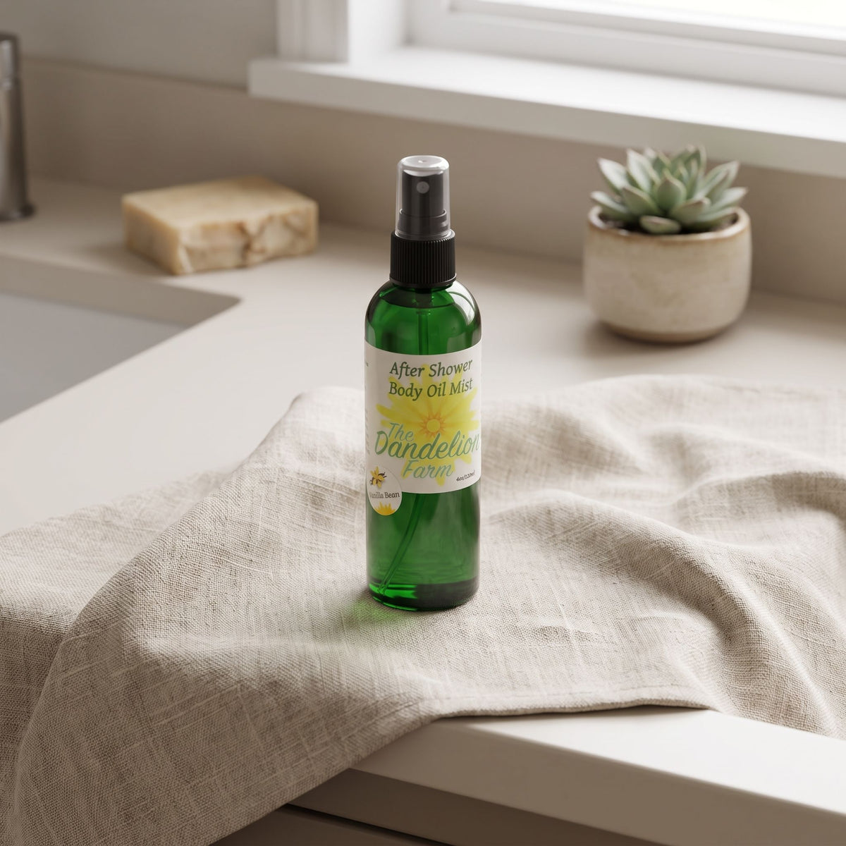 High-angle view of after shower body oil mist on textured linen cloth in minimalistic bathroom setup.