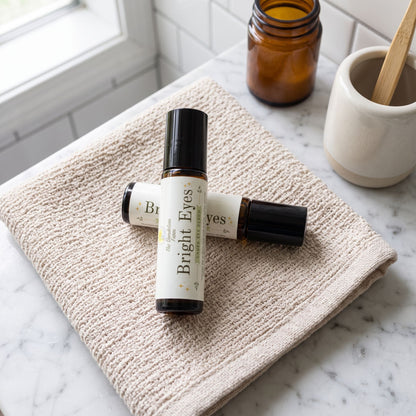 Macro shot of 'Bright Eyes' serum bottle on textured fabric surface, detailed and well-lit in a home bathroom setting.